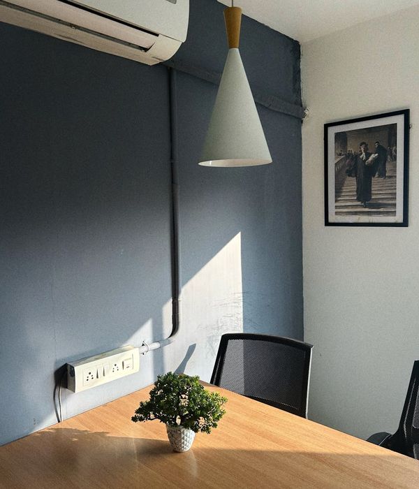 Minimalist workplace with natural light and green plants