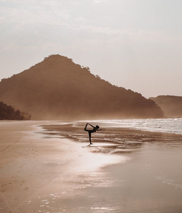 Woman in a serene yoga pose, embodying harmony and balance.